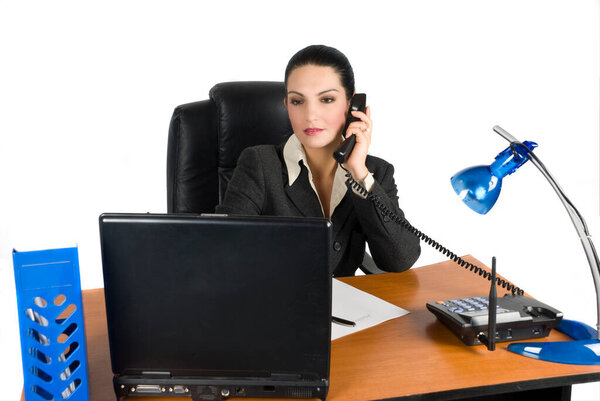 Business woman talking at phone and type on laptop