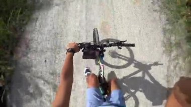 CHONBURI, THAILAND - 6 DEC : Cyclists and mountain bike run on gravel road with high angle view on 6 December 2022 in Bang Phra, Siracha, Chonburi, Thailand