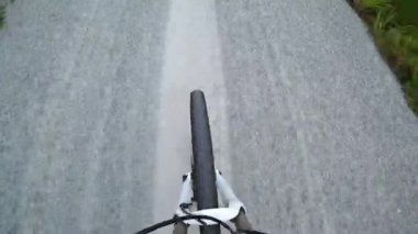 Front wheel of MTB on gravel roads, High angle view