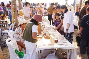 BANGSAEN, THAILAND - 20 JAN : People in art market at beach on 20 January 2024 in Bangsaen beach, Chonburi, Thailand clipart