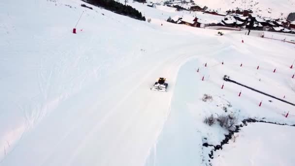 Aerial View Snowcat Working Frozen Snow Slope — Vídeo de Stock