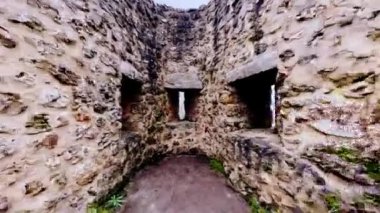 Close up loophole of old French castle fortification in and out pan