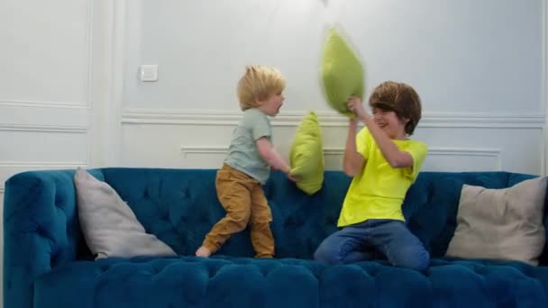Pillow Fight Two Boys Have Fun Pillows Sitting Couch Home — Vídeo de Stock