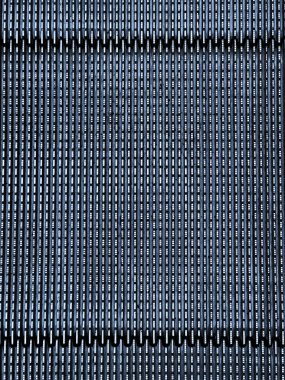 Close-up of the moving stairs of an escalator view above on metal lines