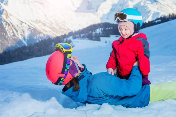 Young Happy Mother Play Daughter Girl Both Wearing Ski Outfit — Fotografia de Stock