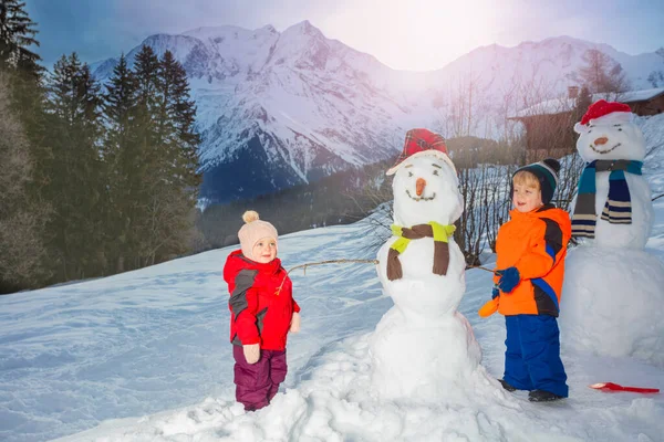 Little Kids Boy Sister Girl Build Dress Snowman Using Scarf — Fotografia de Stock