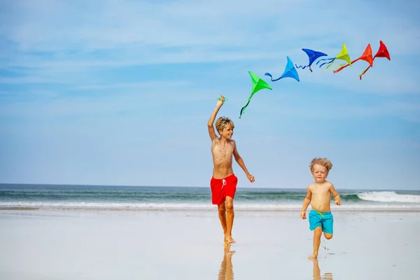 Two Happy Kids Boys Run Holding Many Colorful Kite Beach — Fotografia de Stock