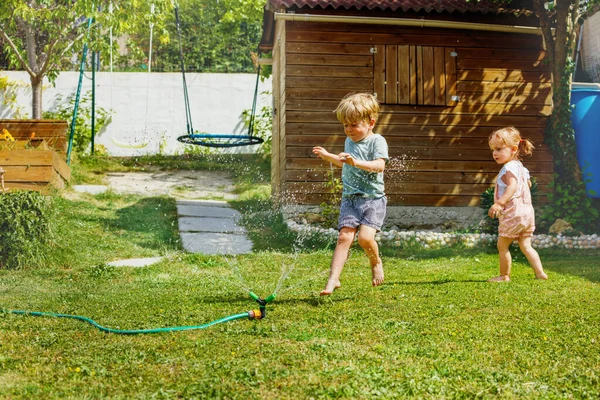 Two Happy Little Kids Boy Girl Run Water Sprinkler Garden — Stock Photo, Image