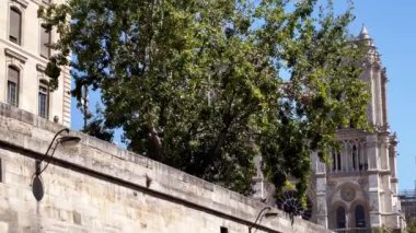 View from the boat on Pont de Sully bridge near Notre Dame, Paris in France on sunny summer day
