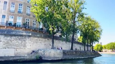 Pont des Arts bridge in Paris, view from boat on Seine river on hot summer day