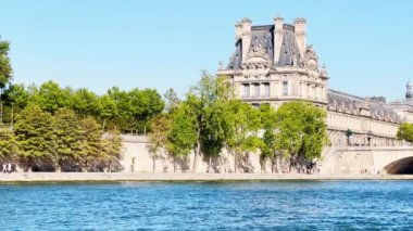 Bridge pont de la Concorde and Grand Palais building on back with boat on Seine river on summer sunny day