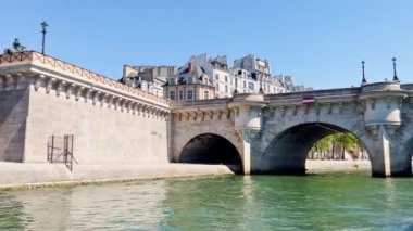 Bridge pont de la Concorde and Grand Palais building on back with boat on Seine river on summer sunny day