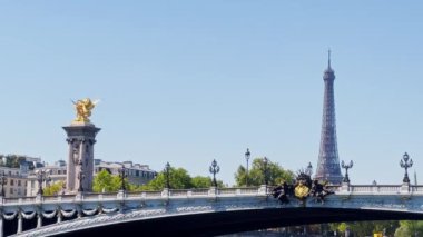 Eiffel tower in France view from the Seine river boat during hot summer day