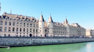 Bridge pont de la Concorde and Grand Palais building on back with boat on Seine river on summer sunny day