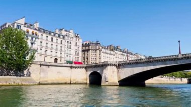 Bridge pont de la Concorde and Grand Palais building on back with boat on Seine river on summer sunny day