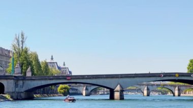 Bridge pont de la Concorde and Grand Palais building on back with boat on Seine river on summer sunny day
