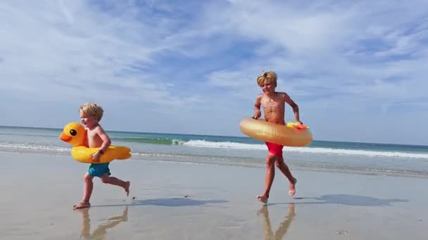 Two Happy Kids Boys Inflatable Toy Buoys Having Fun Running — Video
