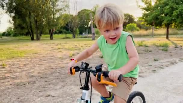 Cute Little Blond Boy Ride Fast Small Bicycle Park Sunset — Stock Video