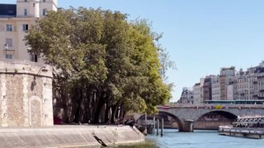 Bridge pont de la Concorde and Grand Palais building on back with boat on Seine river on summer sunny day