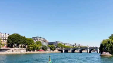 Bridge pont de la Concorde and Grand Palais building on back with boat on Seine river on summer sunny day