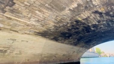 View from the boat on Pont de Sully bridge near Notre Dame, Paris in France on sunny summer day