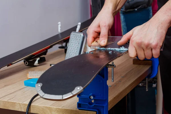 Closeup Hands Carefully Removing Excess Wax Ski Base Plastic Scraper — Stock Photo, Image