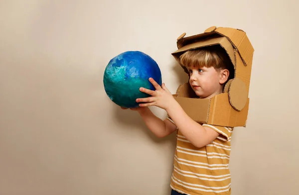 Little Boy Cardboard Astronaut Helmet Hold Planet Earth Blue Green — Stock Photo, Image