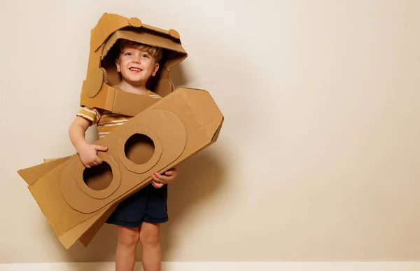 Cheerful Young Boy Wear Cardboard Helmet While Holding His Homemade — Stock Photo, Image