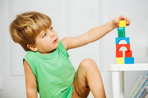Close Child Building Toy Tower Out Wooden Blocks Sitting Living — Stock Photo, Image