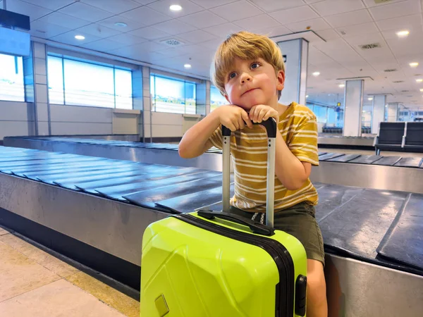 Little Boy Sit Wait Hand Suitcase Baggage Conveyor Belt Waiting — Stock Photo, Image