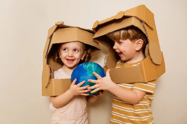 Happy Children Sister Brother Stand Holding Together Planet Earth Cardboard — Stock Photo, Image