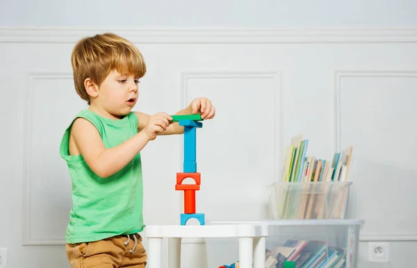 Little Boy Build Toy Tower Playing Wooden Blocks Sitting Carpet — Stock Photo, Image