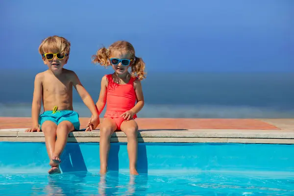 Young Friends Boy Girl Wear Sunglasses Sitting Comfortably Brink Pool — Stock Photo, Image