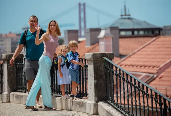 Family Travelers Waving Hands Camera Standing Observation Point Lisbon Portugal — Stock Photo, Image