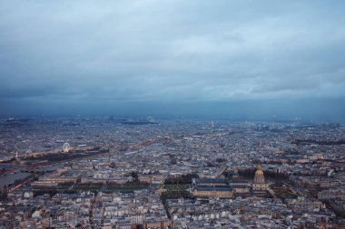 Bird eye shot of Paris center with Invalides Museum on foreground and Tuileries Garden at dusk in winter clipart