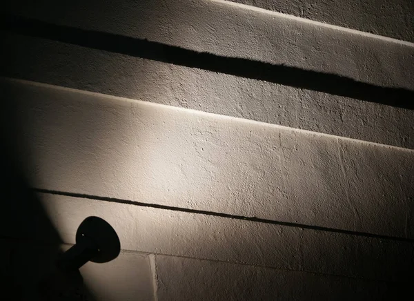 Stock image Lights illuminating the walls of the building at night                               