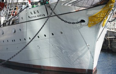  Bow of a sailing ship anchored in the harbor on a clear day                              