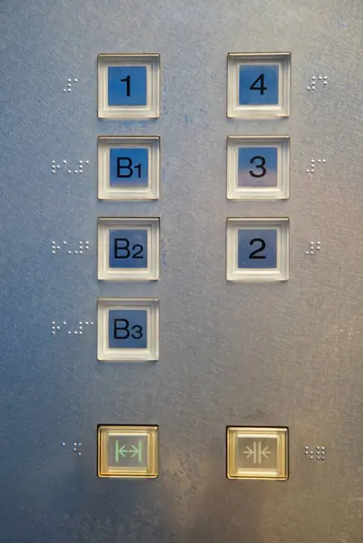 Button of the Japanese elevator with the Braille indication