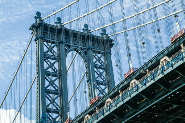 NEW YORK, NY, USA - JUNE 13, 2022: Manhattan bridge view from lower angle in nice day
