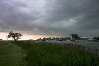 NORWALK, CT, USA MAY 23, 2024: Dark sky before heavy rain coming to the area. View from Veterans park.