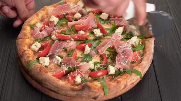 Pizza Cutter Wheel Slicing Ham Pizza Prosciutto Wooden Board Table — Stock Video