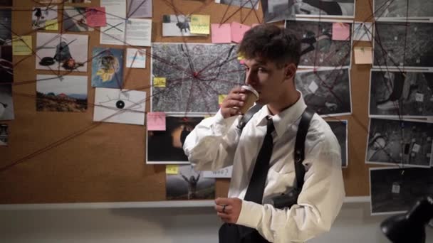 Detective Working His Office Looking Investigation Board Drinking Coffee Searching — Stock Video