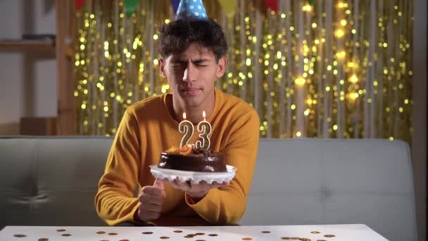 Cheerful Arabic Man Blows Candles Birthday Cake Wears Cone Hat — Video