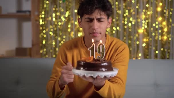 19Th Birthday Young Man Making Wish Blowing Out Number Candles — Vídeos de Stock