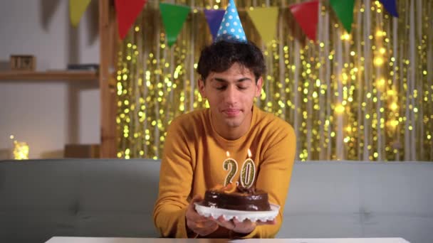 20Th Birthday Young Man Making Wish Blowing Out Number Candles — Vídeos de Stock