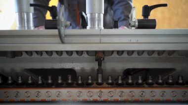 close-up of a drilling machine Forstner drill for large holes. The place is a carpentry shop. The process of production and manufacture of wooden furniture in a factory and woodworking industry