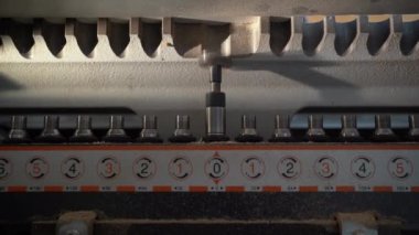 close-up of a drilling machine Forstner drill for large holes. The place is a carpentry shop. The process of production and manufacture of wooden furniture in a factory and woodworking industry