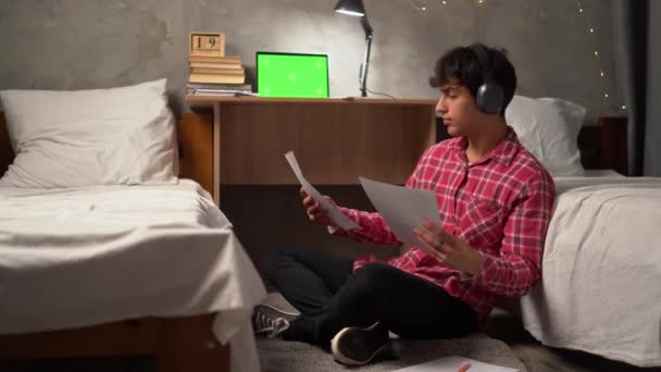 Arab Student Sits Floor Night College Dormitory Dresses Listens Music — Stock video