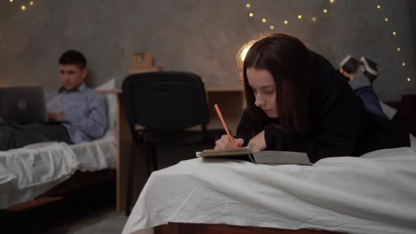 College Dorm Room Young Student Girl Lies Bed Reads Book — Stok video