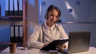 Young female doctor in telemedicine concept. Copy space